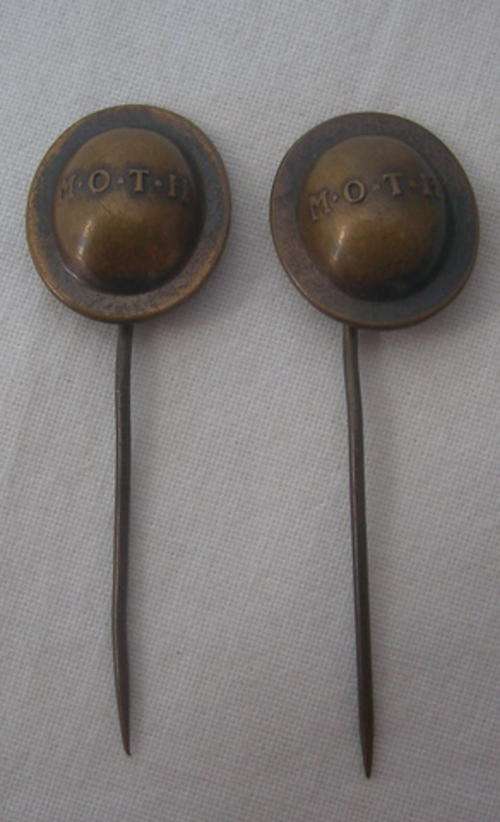 TWO OLD BRASS M.O.T.H. PINS
