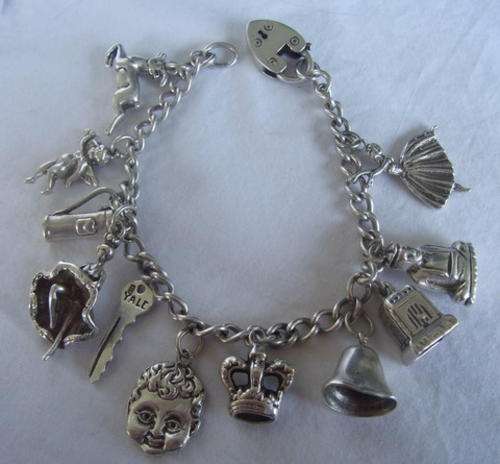 STUNNING STERLING SILVER CHARM BRACELET - HEAVY CHARMS AND  BEAUTIFULL SELECTION