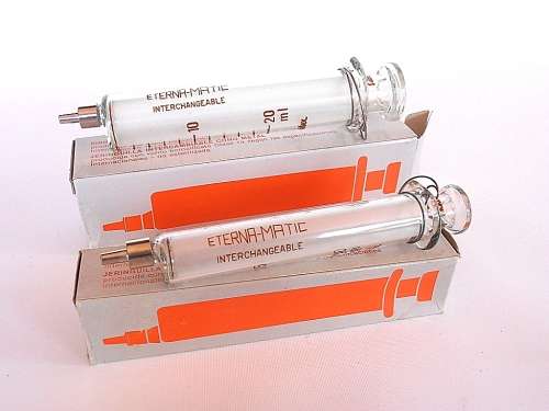 Two Swiss Sanitex Eterna-Matic glass syringes, new in original boxes, 10 ml & 20 ml, Switzerland