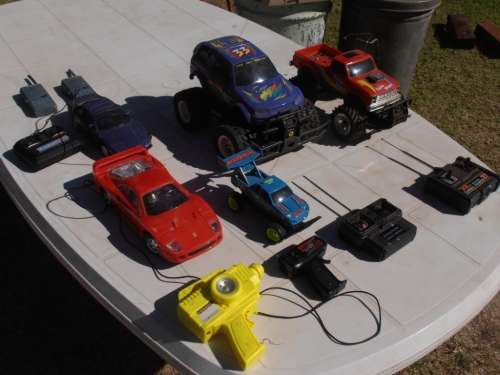 Lot radio controlled cars, Ferrari, monster trucks etc, played with condition, for parts, sold as is