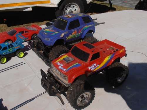 Lot radio controlled cars, Ferrari, monster trucks etc, played with condition, for parts, sold as is