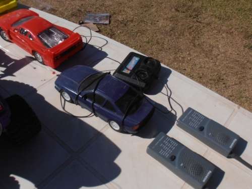 Lot radio controlled cars, Ferrari, monster trucks etc, played with condition, for parts, sold as is