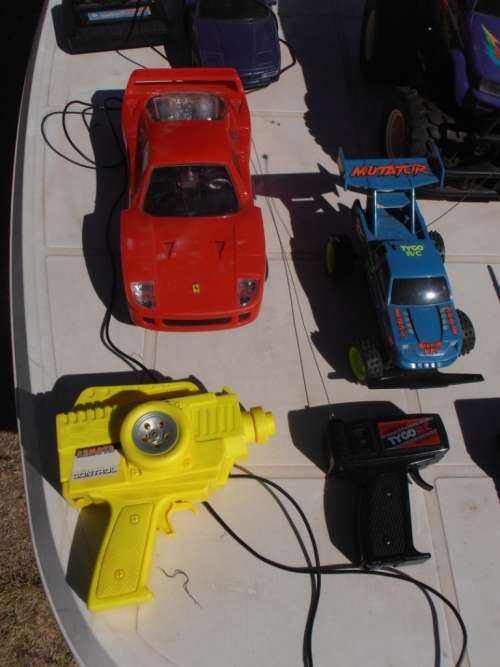 Lot radio controlled cars, Ferrari, monster trucks etc, played with condition, for parts, sold as is