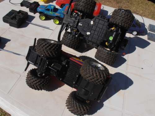 Lot radio controlled cars, Ferrari, monster trucks etc, played with condition, for parts, sold as is