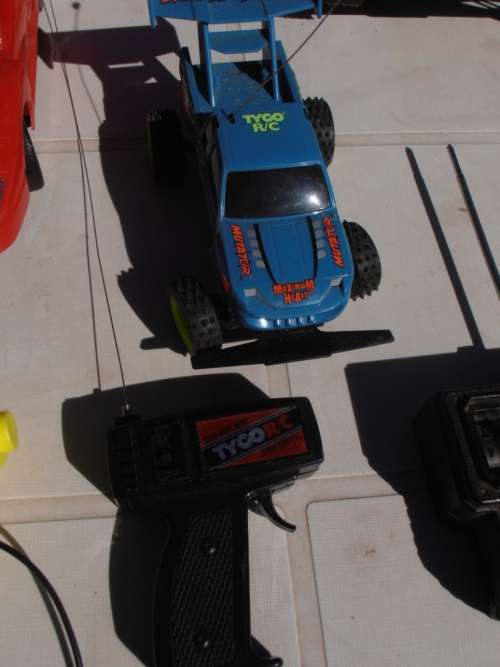 Lot radio controlled cars, Ferrari, monster trucks etc, played with condition, for parts, sold as is