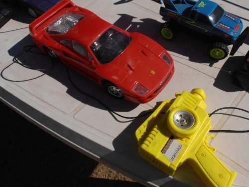 Lot radio controlled cars, Ferrari, monster trucks etc, played with condition, for parts, sold as is