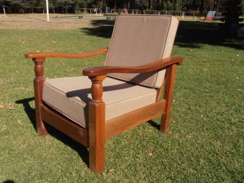 A stylish solid Morris chair with cushions, (one of three available)