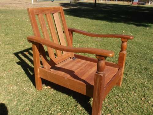 A stylish solid Morris chair with cushions, (one of three available)