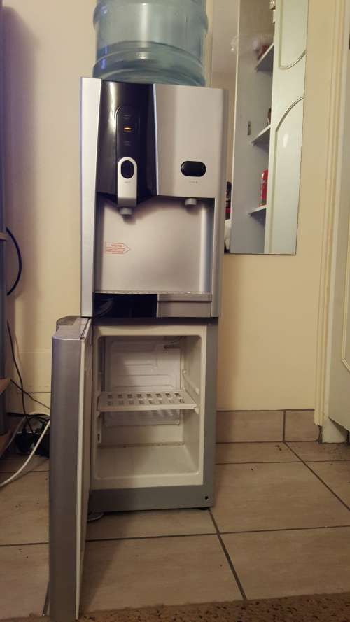 Water dispenser..hot and cold with a build in frige