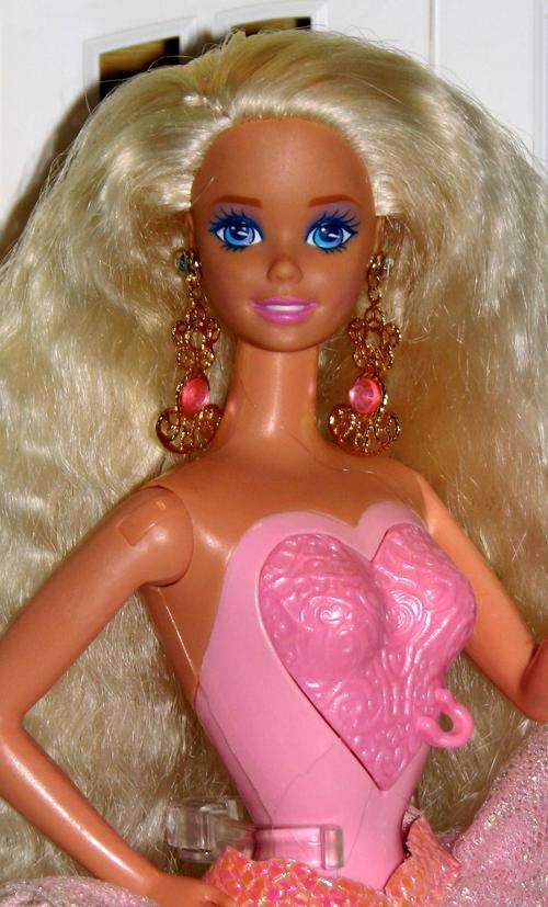 Locket Surprise Barbie doll made by Mattel