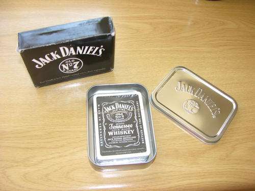 Genuine Jack Daniels playing cards inside presentation tin which sits inside box - Very Nice