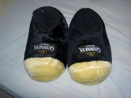 Guinness Slippers Adult - one size fits all due to padding. Very warm