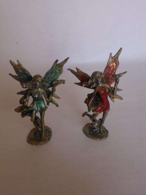 Pair of detailed metal fairies