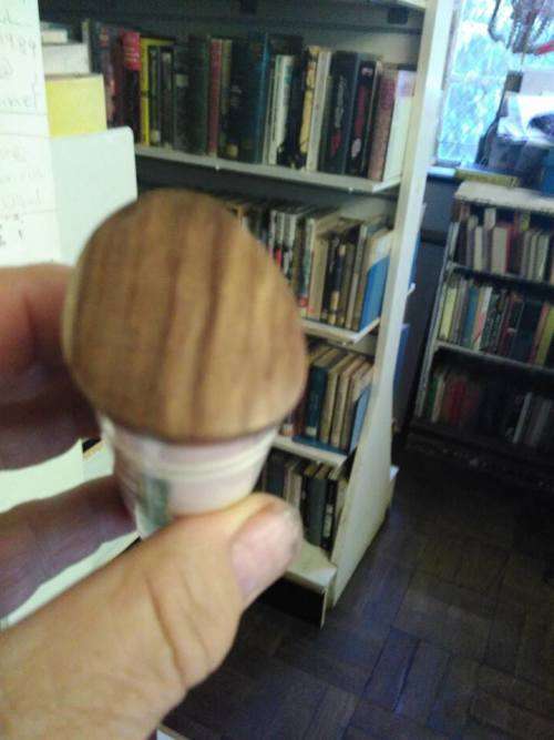 VINTAGE BRASS, BONE AND WOOD BOTTLE OPENER WITH SCRIMSHAW (?) ARTWORK