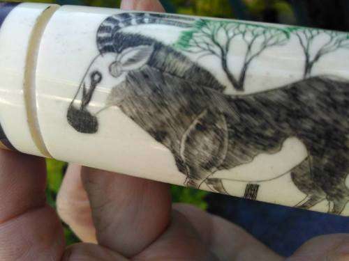 VINTAGE BRASS, BONE AND WOOD BOTTLE OPENER WITH SCRIMSHAW (?) ARTWORK