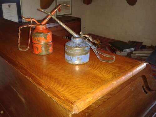 Two vintage oil cans