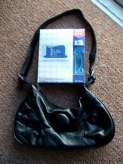 Fragrance for her with black handbag