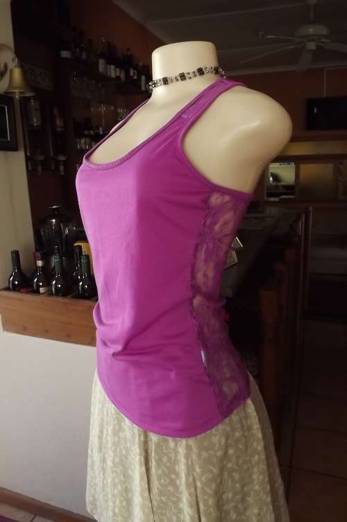 Sexy purple size 32/8 top with lace back.By Real colthing.In good condition.