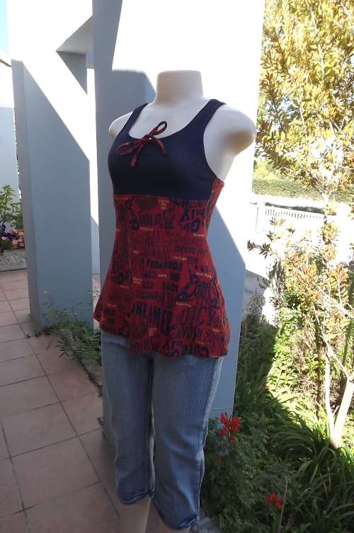 Cute and sexy polyester/nylon stretch top.size 32/8.Brick colour bottom with logos