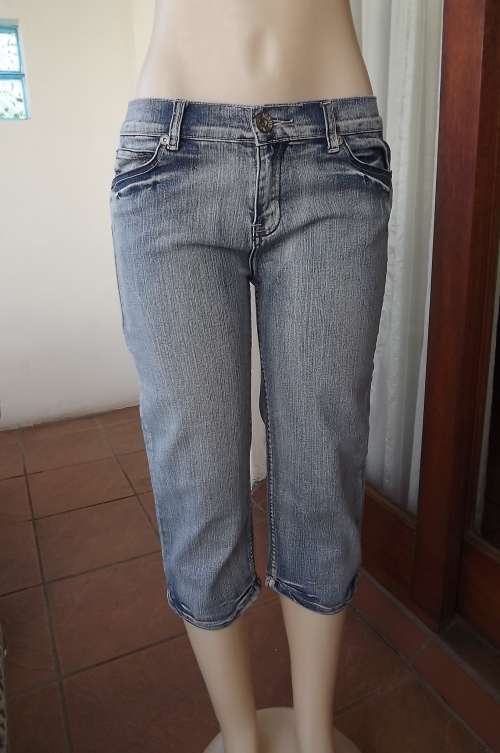 Distress look cropped jeans by News size 36/12 Medium rise.Good condition.