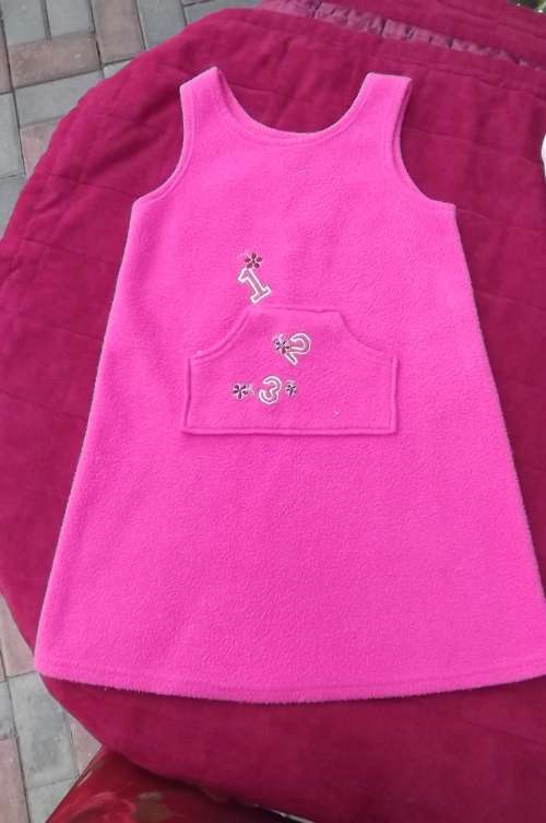 Pink Fleezy polyester dress/ pinafore with pockets on front size 5 to 6 years old