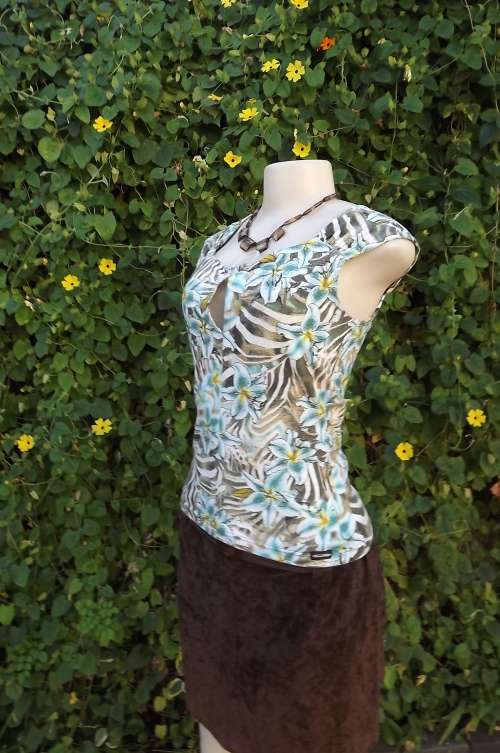 Nicowa stretch cotton top from Germany with pretty blue lily pattern on animal print background