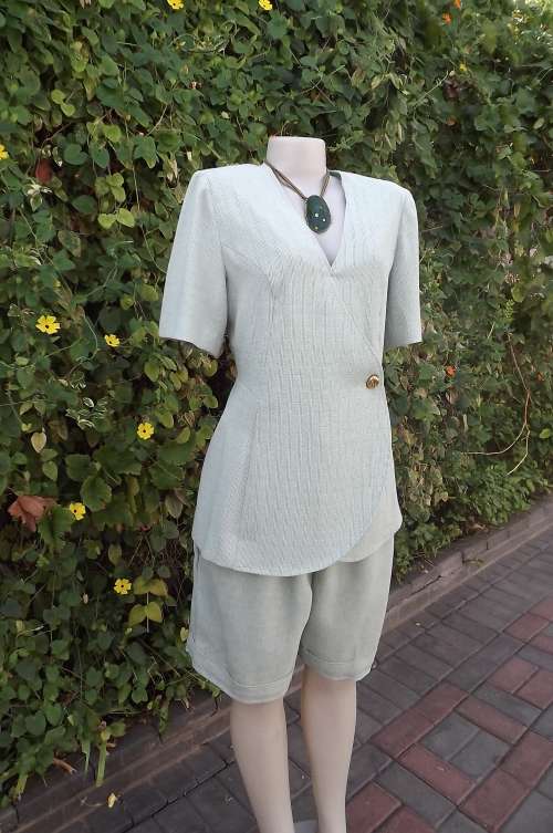 Fabulous boutique made 2 piece outfit.Shorts and stylish jacket.Size 36/12. Mintgreen textured poly.