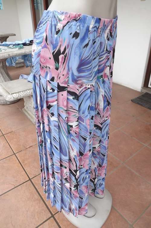 Beautiful sheer polyester yoked skirt with permanent knife pleats.Size 38/14.In soft blues and pinks