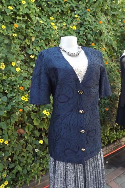 Fabulous boutique made navy styled jacket size 34/10.Embroidered polyester satin fabric.