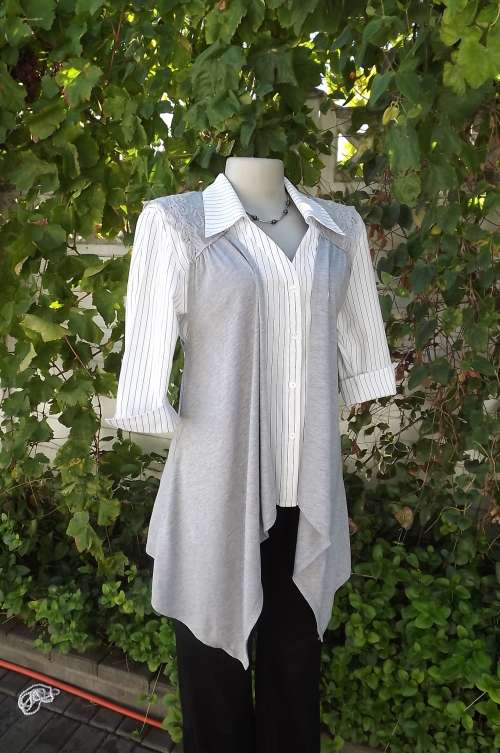 Very pretty silver grey waterfall gilet in size 36/12.Netting and cotton lace decoration on back