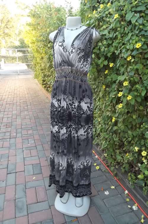 Maxi dress in beige/brown soft polyester in size 36/12.Drawstring on shoulders.