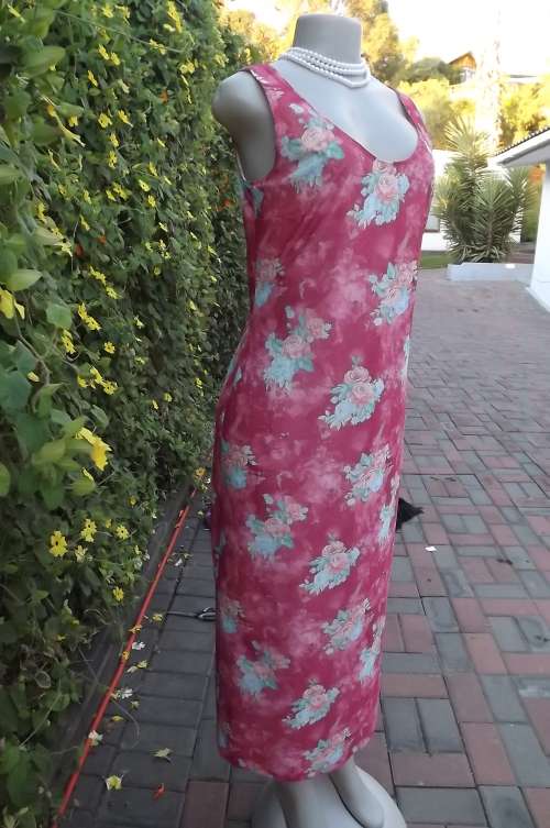 Pretty coral colour long lined dress with long slit at side.Size 34/10. boutique made.