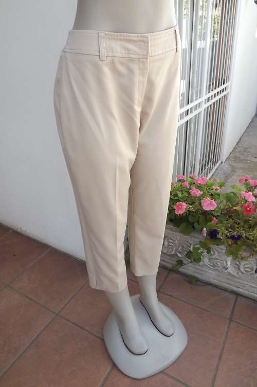 Beige cropped pants in stretch polyester size 36/12.No pockets.Short slits on legs.