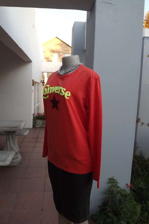 Nectarine colour long sleeve stretch polyester Converse top size 38/14.Good condition