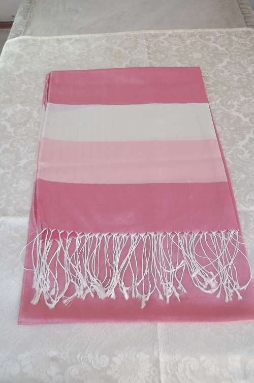 100% Silk scarf in coral pink with lighter stripes.Length 190cm width 70cm. Fringed.