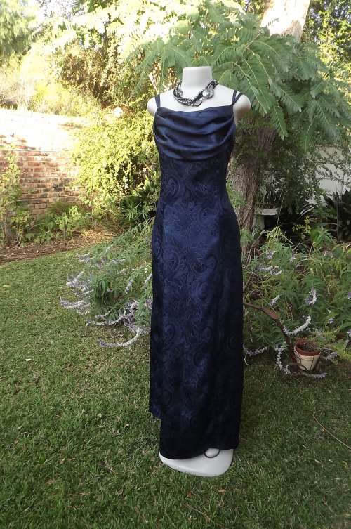 glamorous navy paneled a line evening dress.Size 34/10 polyester shiny flower fabric.Cowl collar
