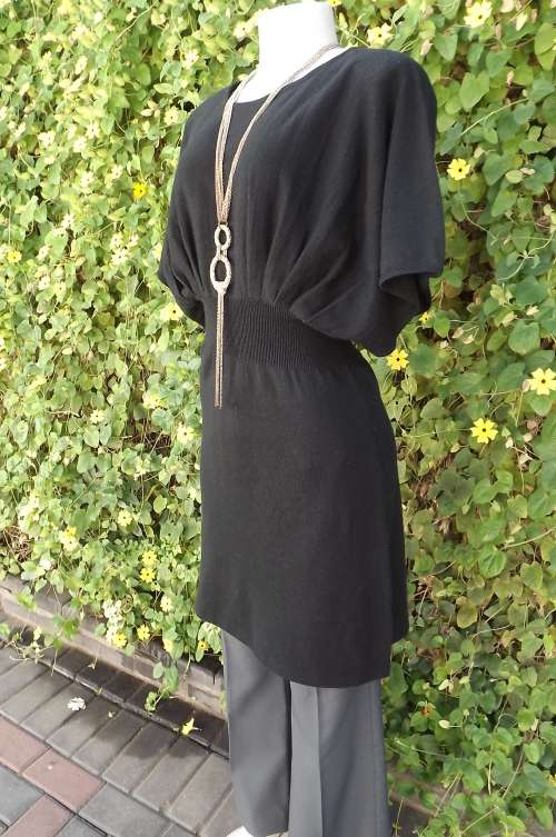 Black knitted long top or knee length dress in acrylic knit in size 36/12. Kimono sleeves.