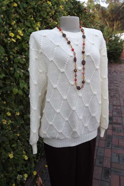 Beautiful crew neck acrylic knit pull over cardigan.Size 40/16 in cream colour. New condition.