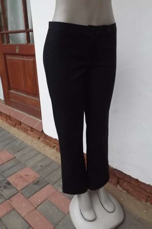 Smart black pants in size 32/8 by Spirit.No pockets.Wash + wear polyester fabric.New condition.