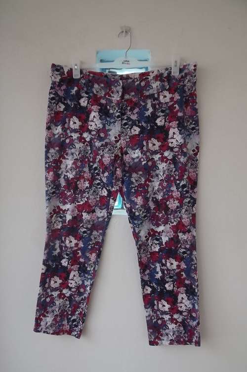 High Fashion stretch polyester pants by Fashion Express size 42/18 in purple/blue on white floral .
