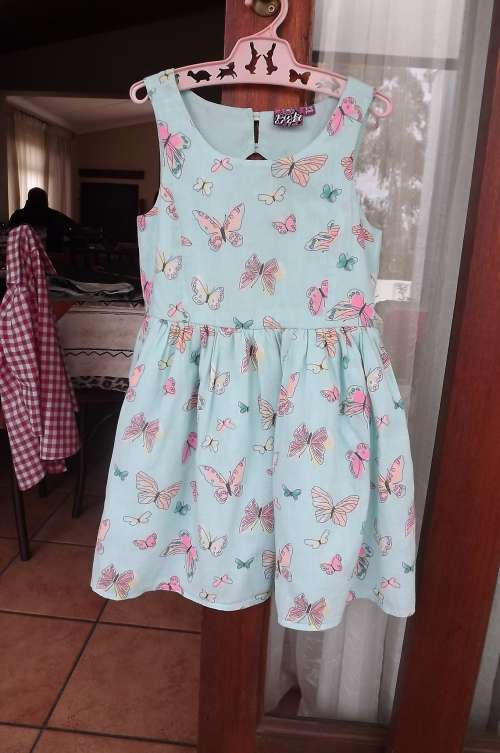 Pink Angel turquoise dress for girl of 9 to 10 year old.100% cotton in 2 layers.