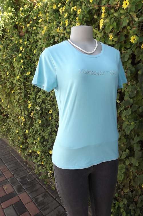 Light turquoise T shirt in cotton and lycra. Size 36/12.Some embellishment on front.