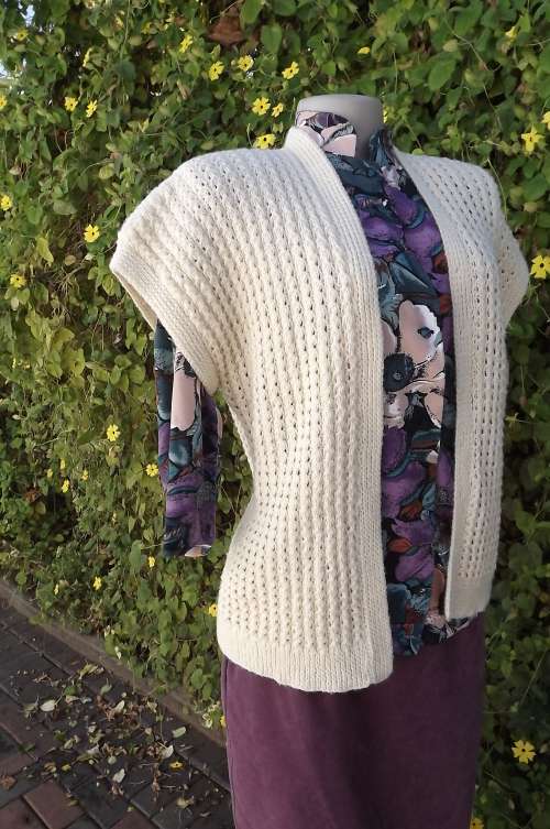 Hand knitted ladies cream waistcoat in size 38/14.Knitted in tiny cables.New item