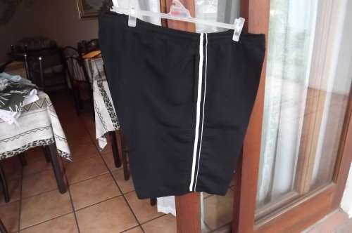 Black No Boundries 100% polyester shorts with tiestring in middle.Size XXL.White stripes at sides