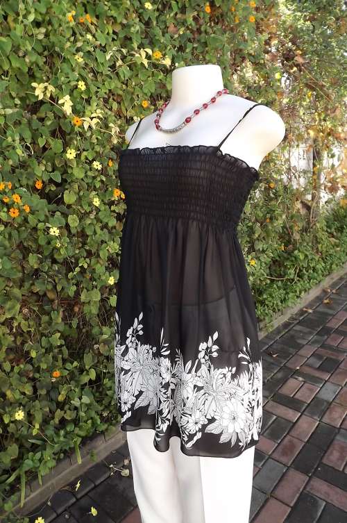 Pretty black sheer top with elasticated bust area and thin shoulder straps.Size 32/8.As new