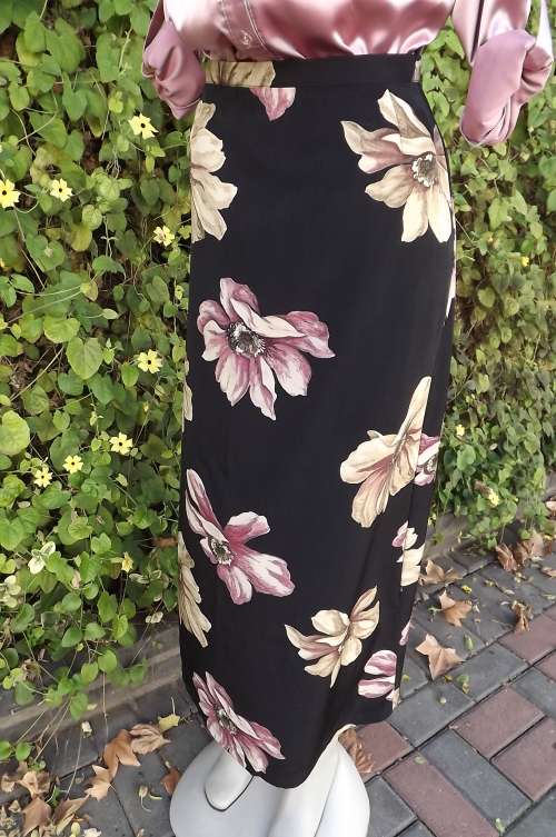 Power print black A line maxi skirt in 100% polyester bold single flowers in pink and beige.