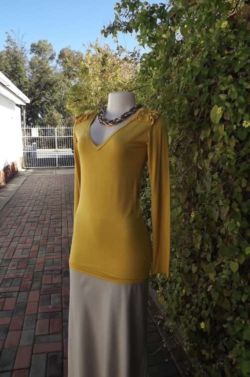 Chic mustard colour long V neck cotton stretch top by Zillah in size 34/10.Frills on shoulders.