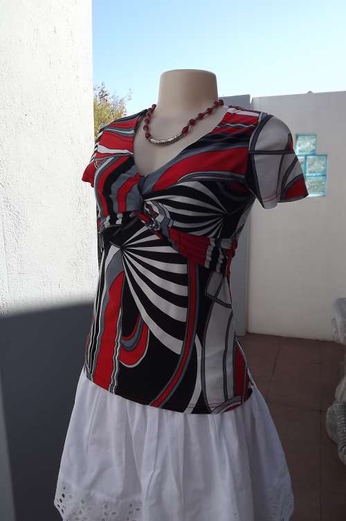 Pretty soft silky red/black and white geometric patterned top size 32/8.As new