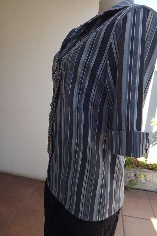 Classy Milady's blue/navy vertically striped V top with collar in size 38/14.Cuffed short sleeves