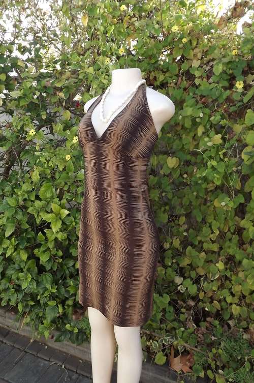 Sexy little bodycon dress with halterneck in brown colours.Size 32/8.Polyester/lycra fabric